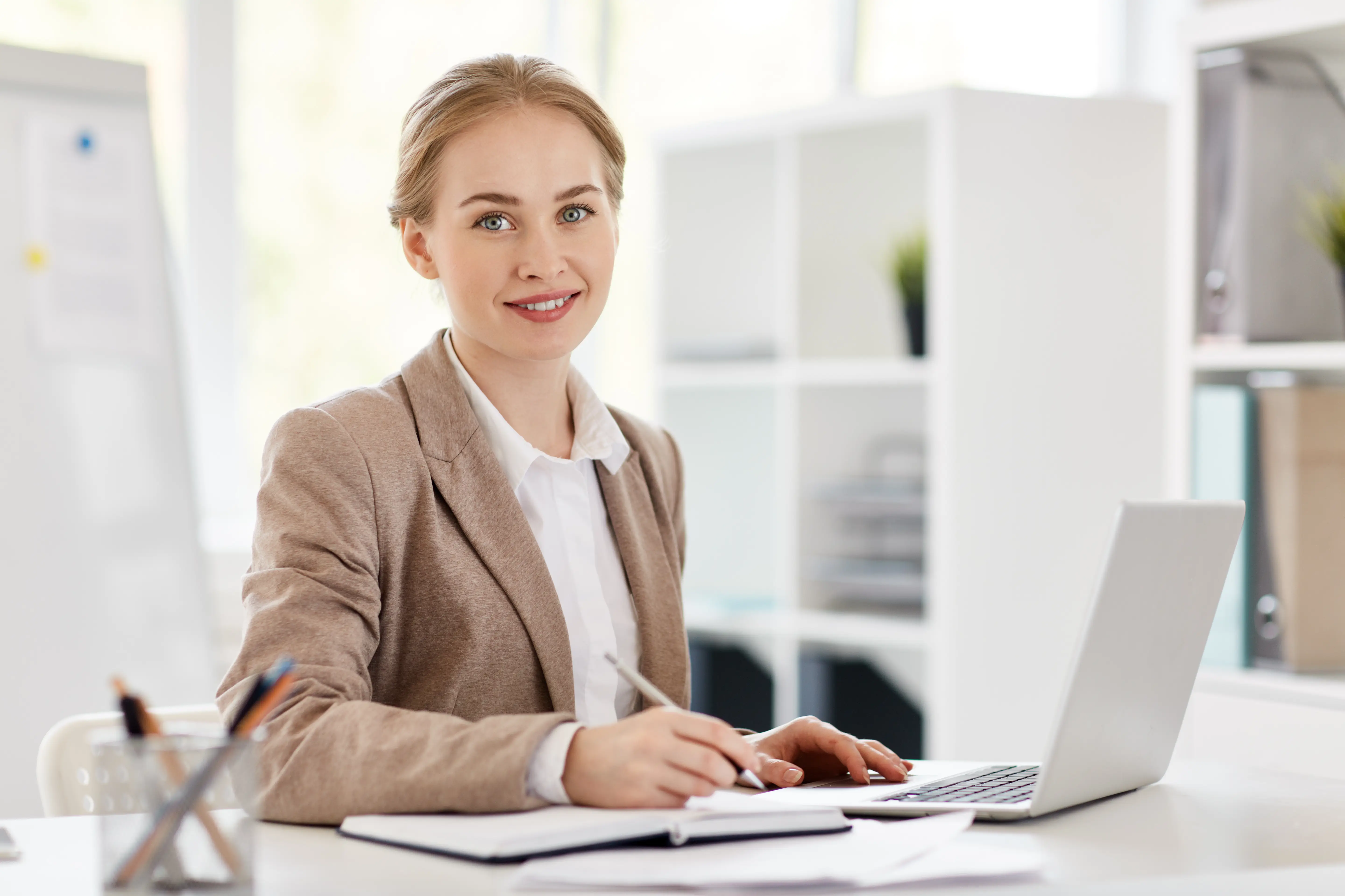 An accountant at her desk reviewing client work